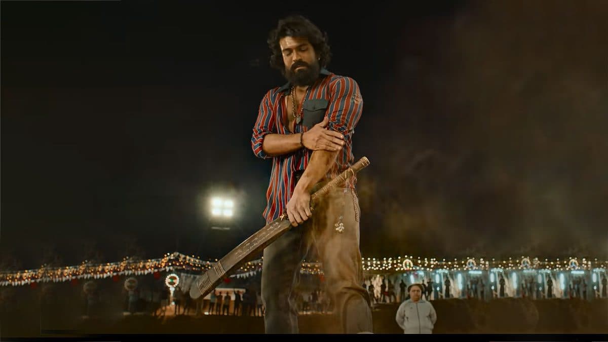 Peddi (2026) — Ram Charan rugged sports drama, Buchi Babu Sana direction; rural Andhra 1980s cricket + wrestling poster