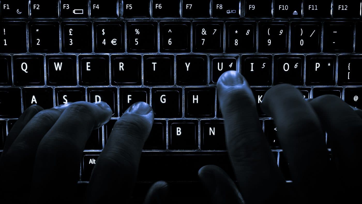 UK COS Job Visa Scam Alert — keyboard, online fraud illustration